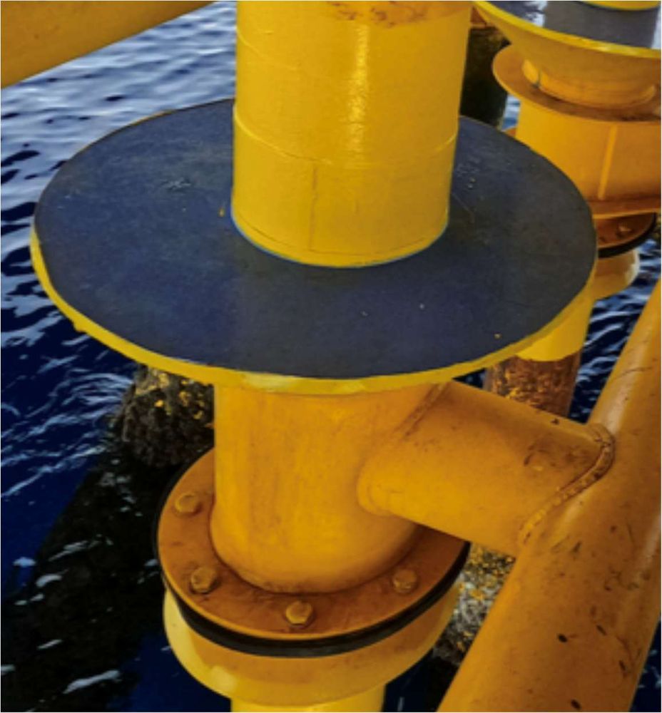 Close-up of a riser wear-protection sleeve fitted at a platform conductor