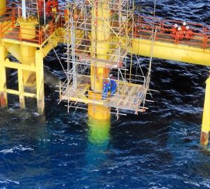 Field crew supporting a riser installation on an offshore platform